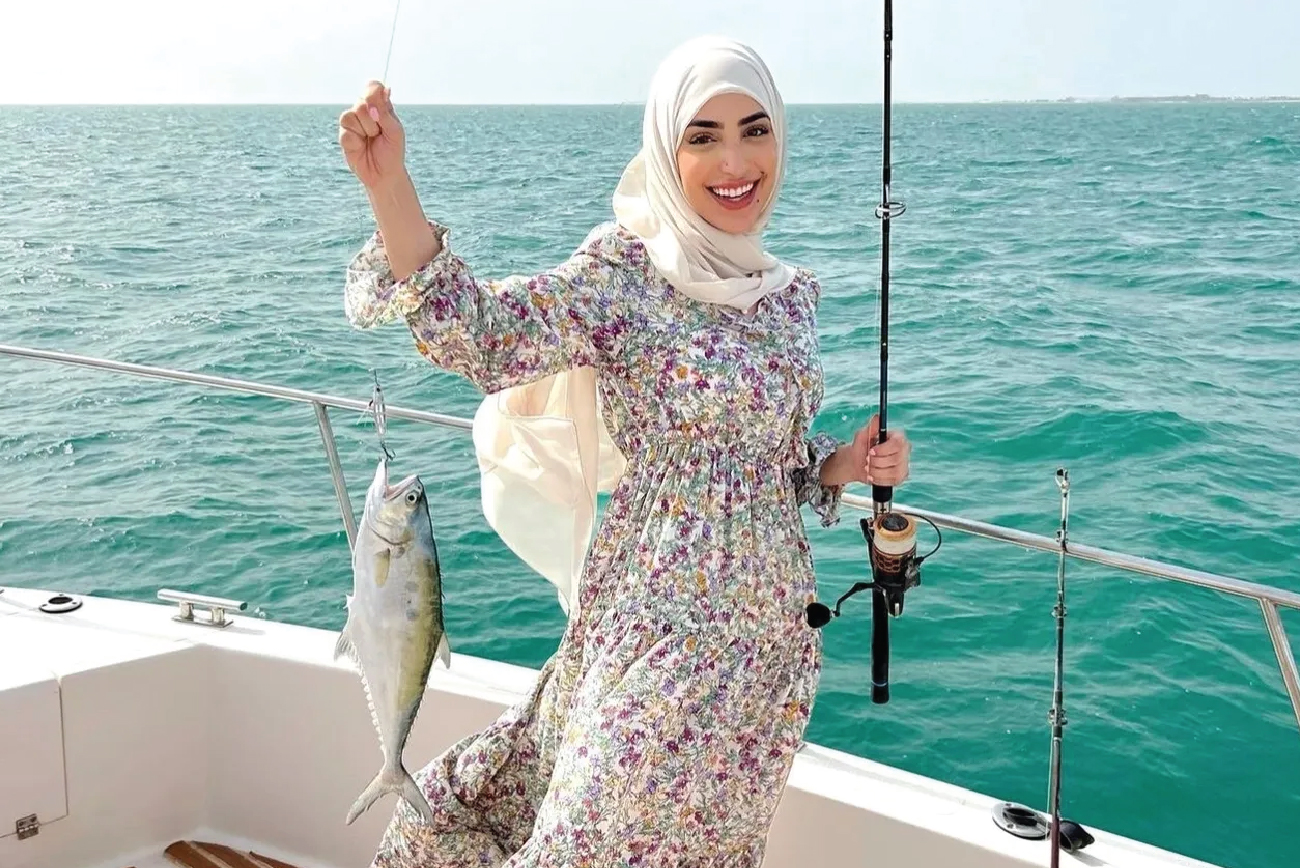 Happy guest with fresh catch on Dubai fishing trip